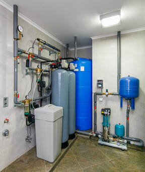 A water treatment system installed in the garage of a residential property in Orlando, FL